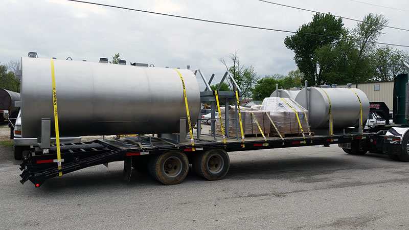 (2) 550 gal and (1) 2000 gal horizontal double wall tanks made from 304 stainless steel for both the inner tank and outer wrap, on small tank saddles. Ladder and platforms shipping along with standard tank accessories (installed by others) to a military site.
