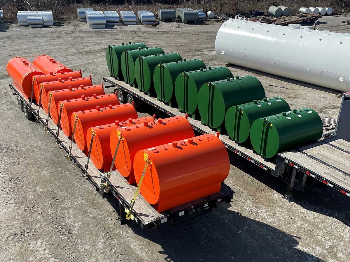 ORANGE 550 & 1100 GAL DW; GREEN 550 & 64” DIA. 1000 gal DW, BOX SKID supports; BACKGROUND: WHITE 20000 GAL SW HORZ FOR DE-ICER FLUID with PLATFORM CLIPS