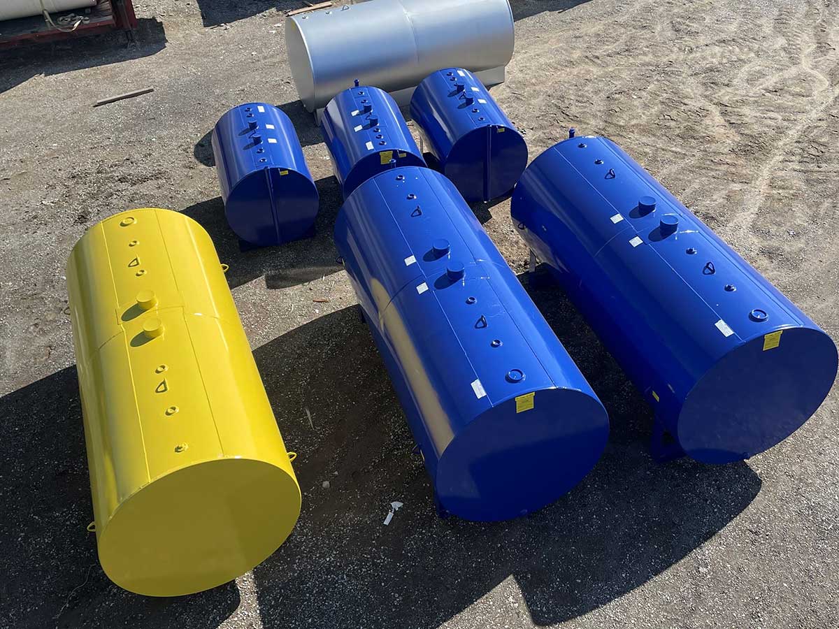 YELLOW AND BLUE 2000 GAL DW HORZ ON SADDLES; BLUE 550 GAL DW ON SADDLES